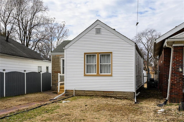 view of side of property with fence