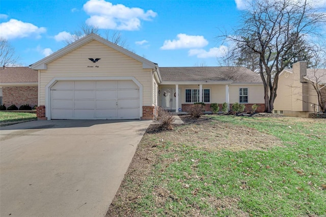 ranch-style house featuring a garage, concrete driveway, brick siding, and a front lawn