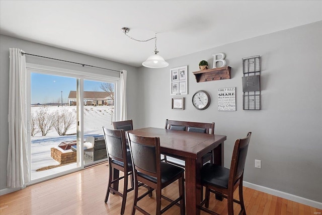 dining room with wood finished floors and baseboards