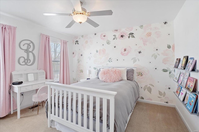 bedroom with light carpet, ceiling fan, baseboards, and wallpapered walls