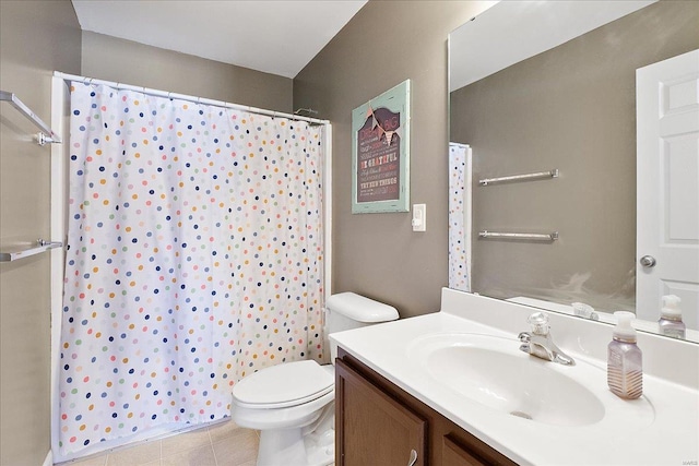 full bathroom featuring a shower with curtain, tile patterned flooring, vanity, and toilet