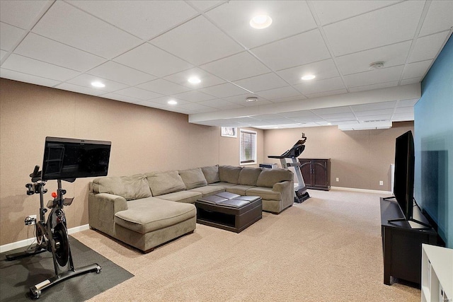 living room with baseboards, recessed lighting, a paneled ceiling, and light colored carpet