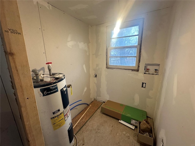 interior space featuring water heater and washer hookup