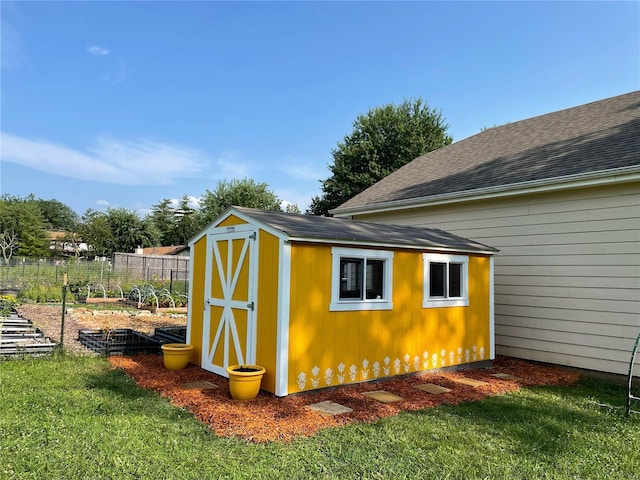 view of outbuilding featuring a yard