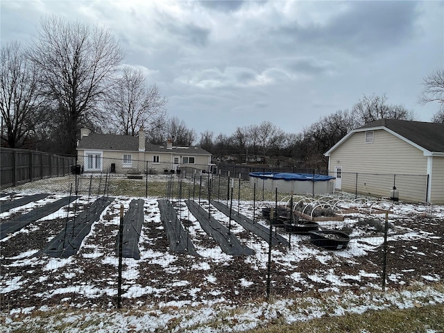 view of yard layered in snow