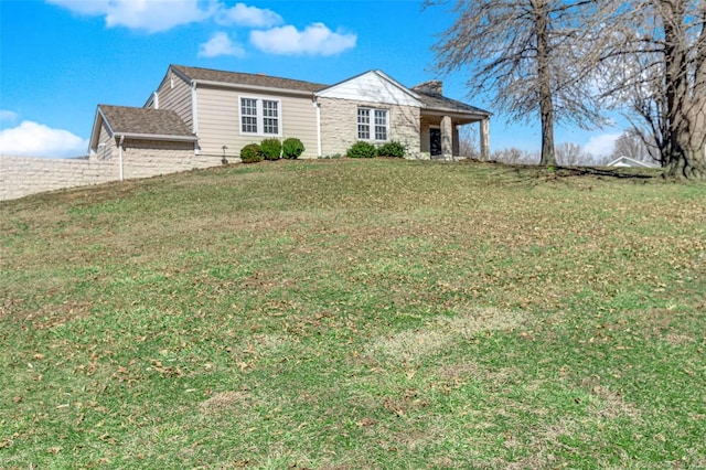 ranch-style house with a front yard