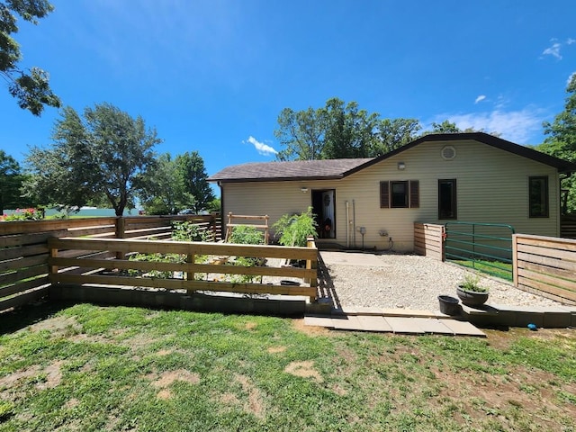 back of property with fence