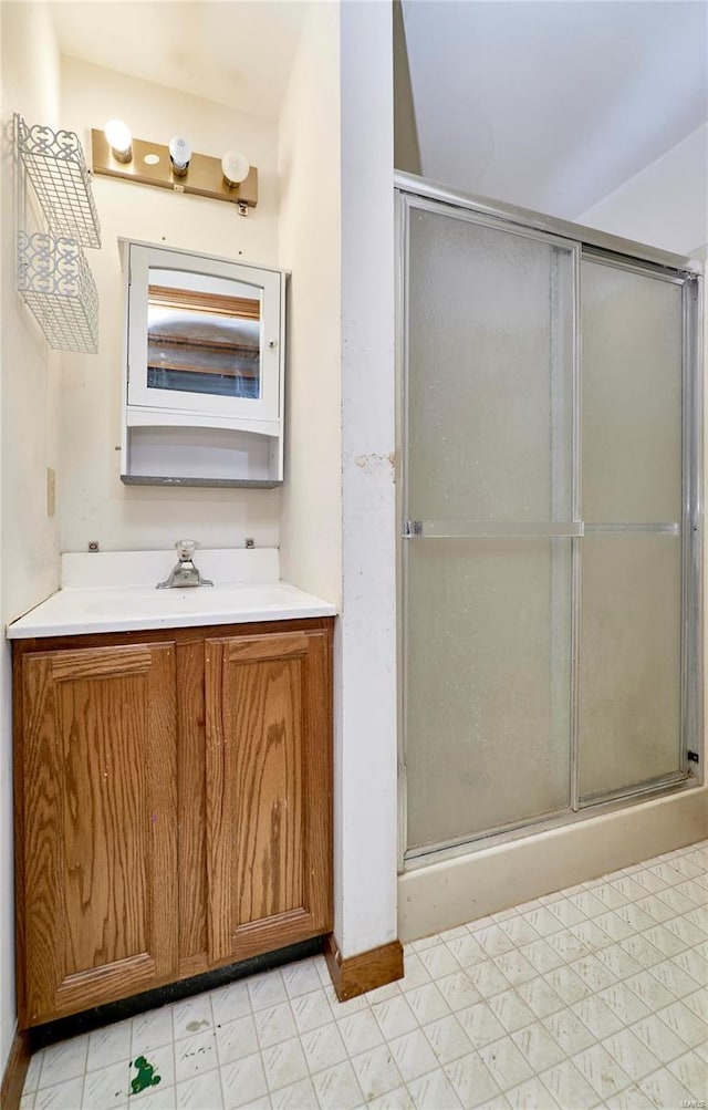 full bath featuring a shower stall and vanity