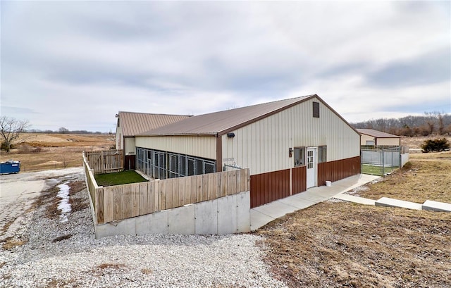 view of home's exterior with fence