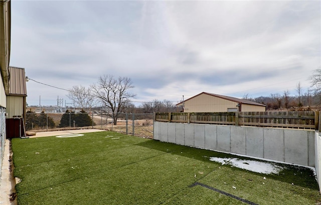 view of yard with a fenced backyard