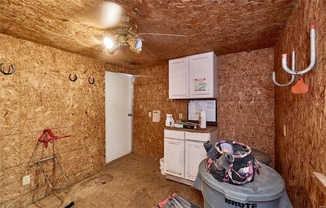 kitchen with white cabinetry and a ceiling fan