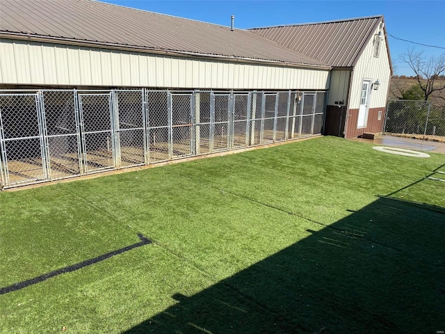 view of yard with an outbuilding and an exterior structure