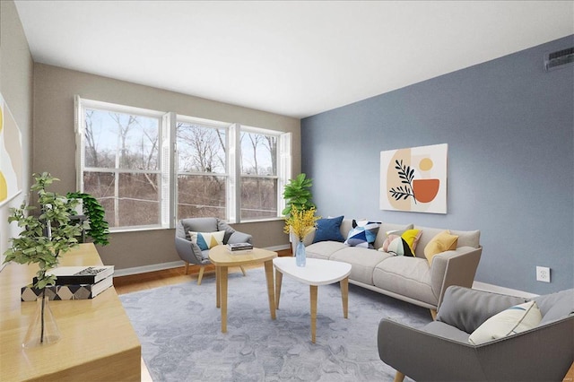 living room featuring visible vents, baseboards, and wood finished floors