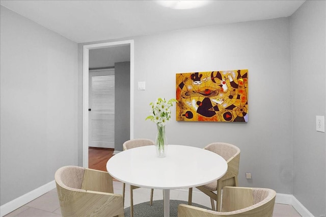 dining room featuring baseboards