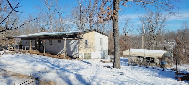 view of snow covered property