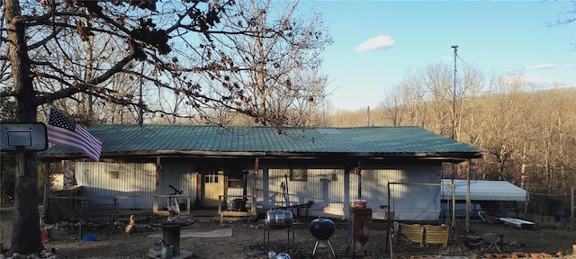 back of property with metal roof