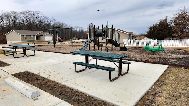 communal playground featuring fence