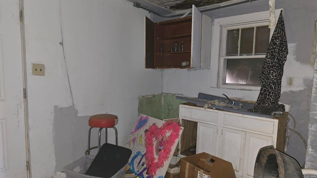 kitchen featuring white cabinets