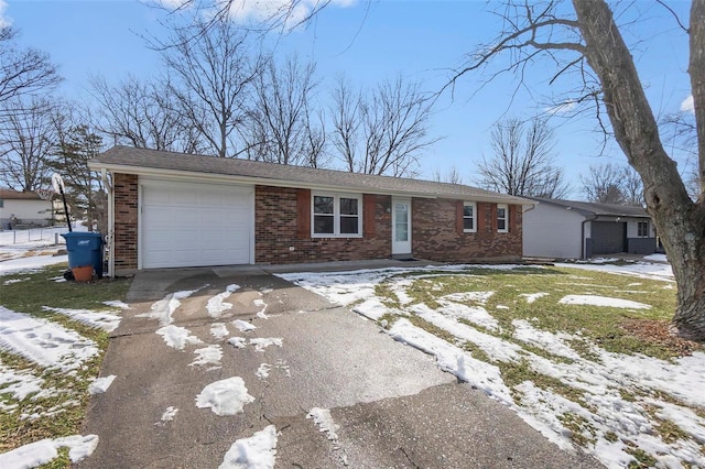 ranch-style home with an attached garage, driveway, and brick siding