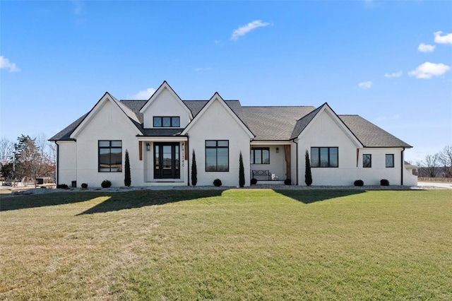 modern inspired farmhouse with a front lawn