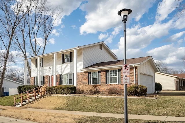 greek revival inspired property with a garage, brick siding, and a front lawn