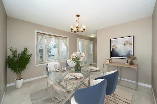 dining area with light colored carpet, baseboards, and a notable chandelier