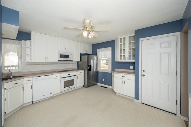 kitchen featuring white appliances, white cabinetry, a ceiling fan, and open shelves