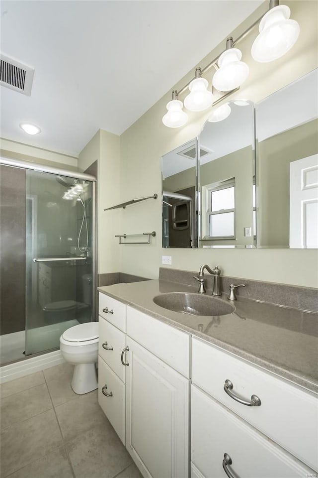 full bath featuring visible vents, toilet, a stall shower, tile patterned floors, and vanity