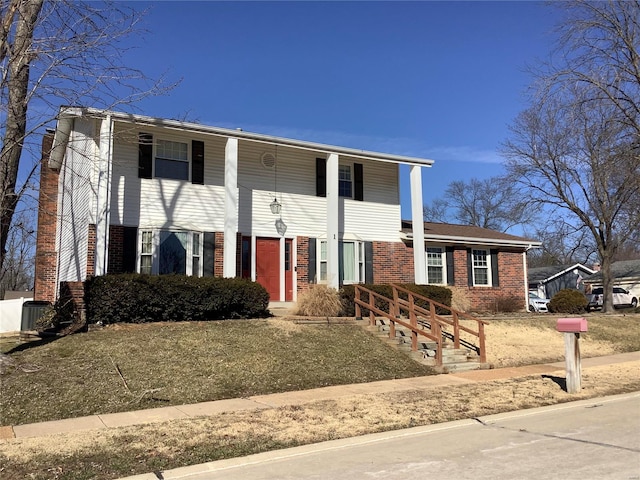 view of front of home with brick siding