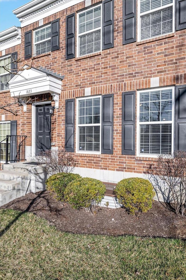 entrance to property with brick siding