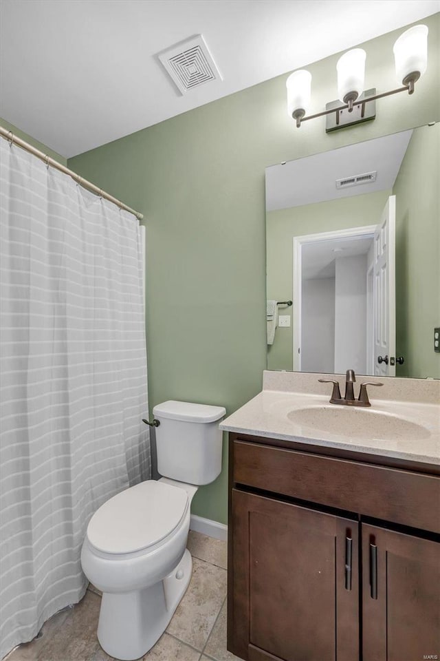 bathroom featuring tile patterned flooring, visible vents, toilet, and vanity