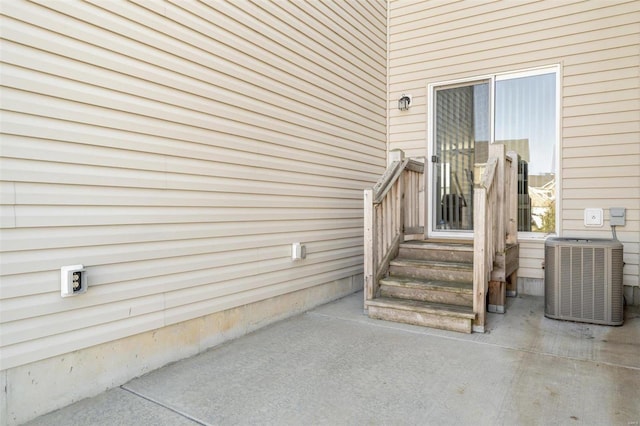 entrance to property featuring central AC unit