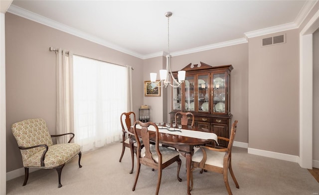 dining space with ornamental molding, light colored carpet, visible vents, and a notable chandelier