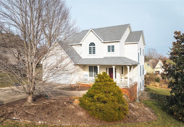 view of front of home featuring a porch and a shingled roof