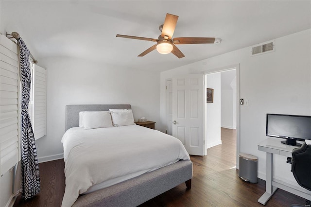 bedroom featuring ceiling fan, dark wood-style flooring, visible vents, and baseboards