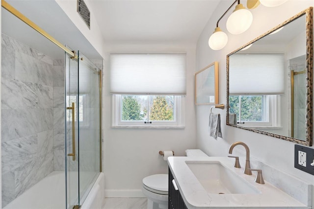 bathroom featuring baseboards, plenty of natural light, visible vents, and toilet