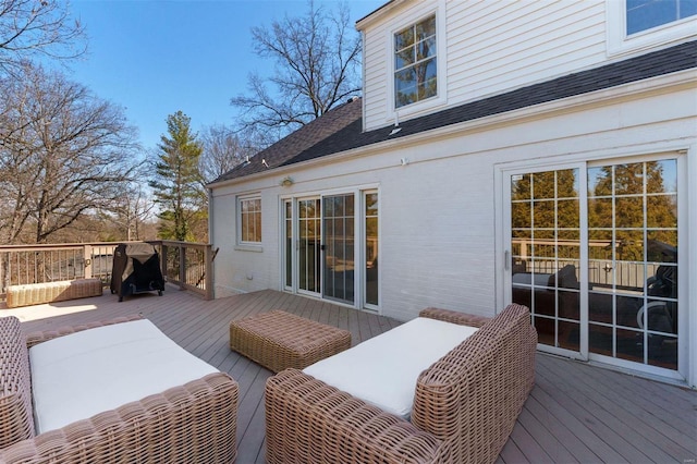 wooden terrace featuring an outdoor hangout area