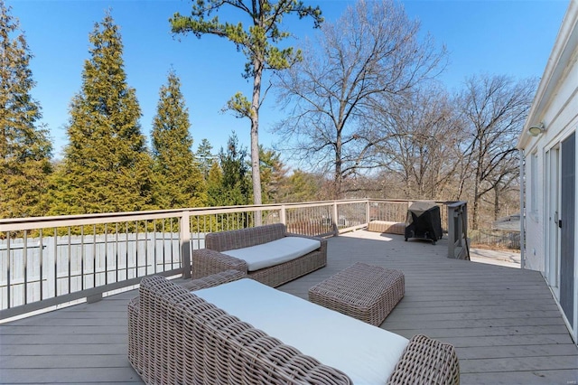 deck featuring a grill and an outdoor hangout area