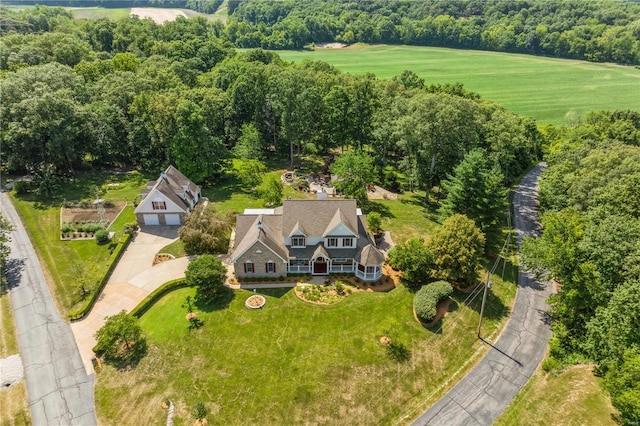 aerial view featuring a wooded view