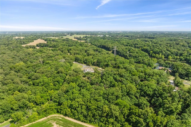 aerial view featuring a wooded view