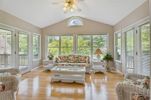 sunroom / solarium with a ceiling fan and lofted ceiling