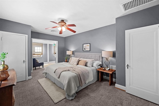 carpeted bedroom with baseboards, visible vents, and ceiling fan