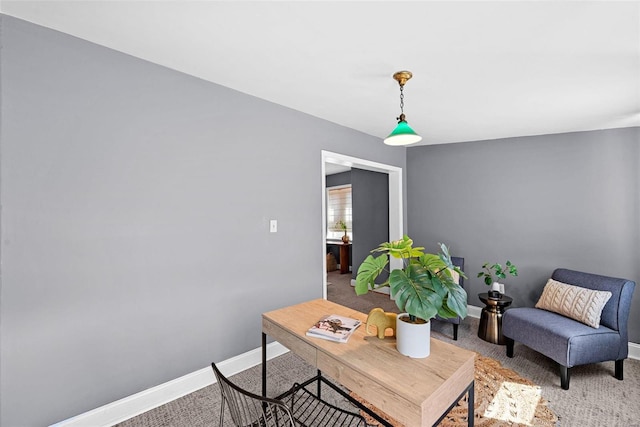 carpeted living room with baseboards