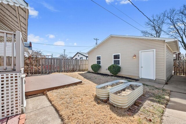 view of yard with fence and a wooden deck