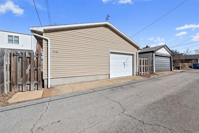 detached garage with fence