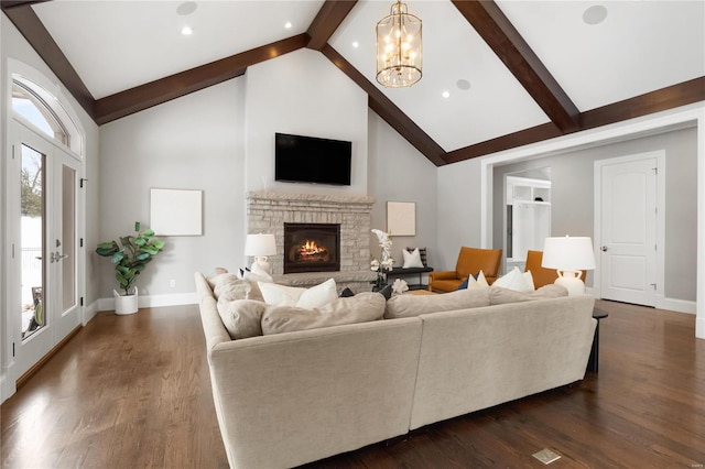 living room with dark wood-style floors, a fireplace, beamed ceiling, and high vaulted ceiling