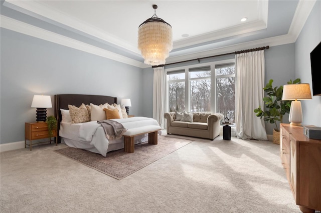 bedroom with a notable chandelier, a tray ceiling, crown molding, and light colored carpet