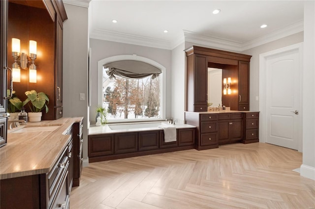 bathroom featuring ornamental molding, recessed lighting, and a bath