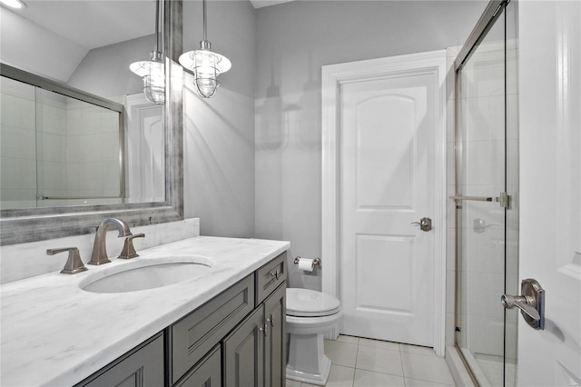 full bath featuring toilet, vaulted ceiling, a shower stall, vanity, and tile patterned floors