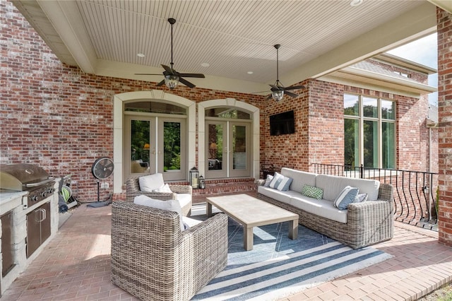 view of patio / terrace featuring a ceiling fan, outdoor lounge area, a grill, and area for grilling